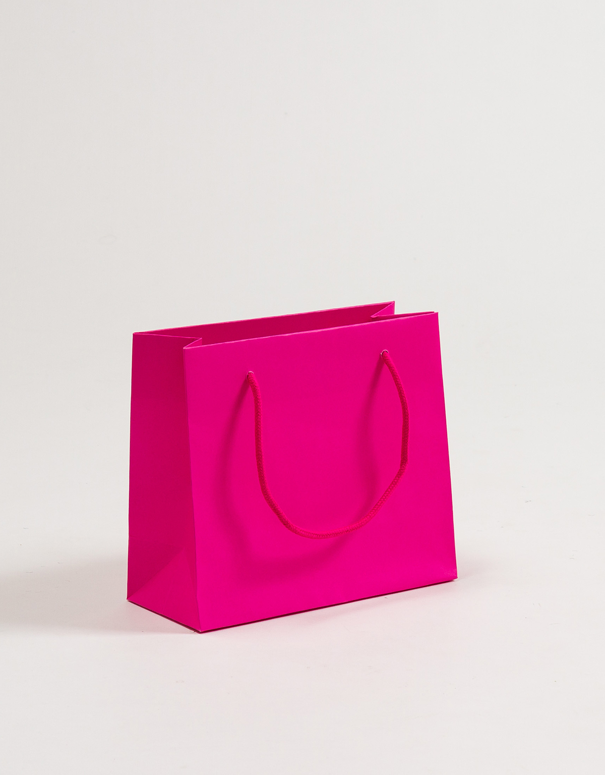 Produktbild Papiertragetaschen POP mit Stoffkordel pink in der Größe 23 x 10 x 20 + 5 cm